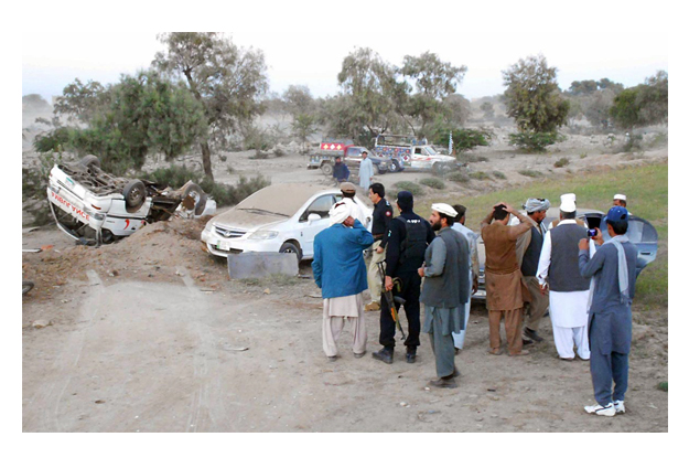 people and security seen at the site of attack on convoy of federal housing and works minister and jui f leader akram khan durrani photo online