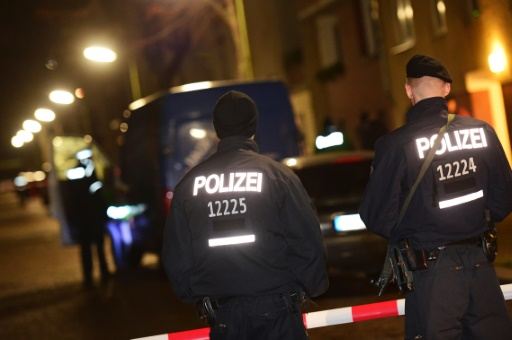 armed police stand guard as others search a van at the scene in the karl elsasser street in berlin 039 s southern suburb of britz on november 26 2015 photo afp