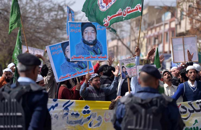 supporters of former police bodyguard mumtaz qadri hold posters bearing his image as they gather opposite a police cordon outside the high court in islamabad photo afp supporters of former police bodyguard mumtaz qadri hold posters bearing his image as they gather opposite a police cordon outside the high court in islamabad photo afp