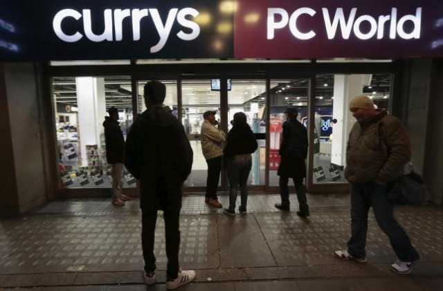 people wait outside a currys pc world shop before the early opening of the black friday sales on tottenham court road in london november 27 2015 photo reuters