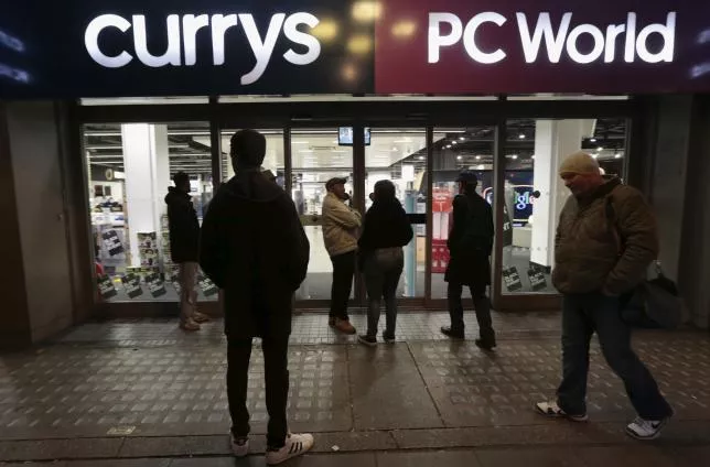 people wait outside a currys pc world shop before the early opening of the black friday sales on tottenham court road in london november 27 2015 photo reuters people wait outside a currys pc world shop before the early opening of the black friday sales on tottenham court road in london november 27 2015 photo reuters