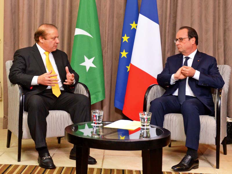 pm nawaz talks with francois hollande during a meeting in valletta photo afp