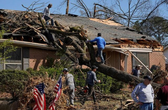 people work to remove a tree that fell onto a home in the aftermath of a tornado after a monster storm system tore through the south and midwest on friday in little rock arkansas us april 2 2023 photo reuters people work to remove a tree that fell onto a home in the aftermath of a tornado after a monster storm system tore through the south and midwest on friday in little rock arkansas us april 2 2023 photo reuters