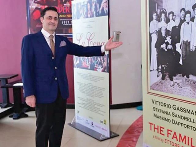 italian cinema the consul general of italy in karachi fabrizio bielli points towards the posters of italian classical movies the family and the diner directed by ettore scola italian cinema the consul general of italy in karachi fabrizio bielli points towards the posters of italian classical movies the family and the diner directed by ettore scola