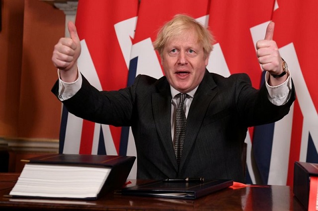 britain s prime minister boris johnson gives a thumbs up after signing the brexit trade deal with the eu at number 10 downing street in london britain december 30 2020 photo reuters