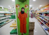 a hoarding with an image of baba ramdev is seen inside a patanjali store in ahmedabad india march 28 2019 photo reuters