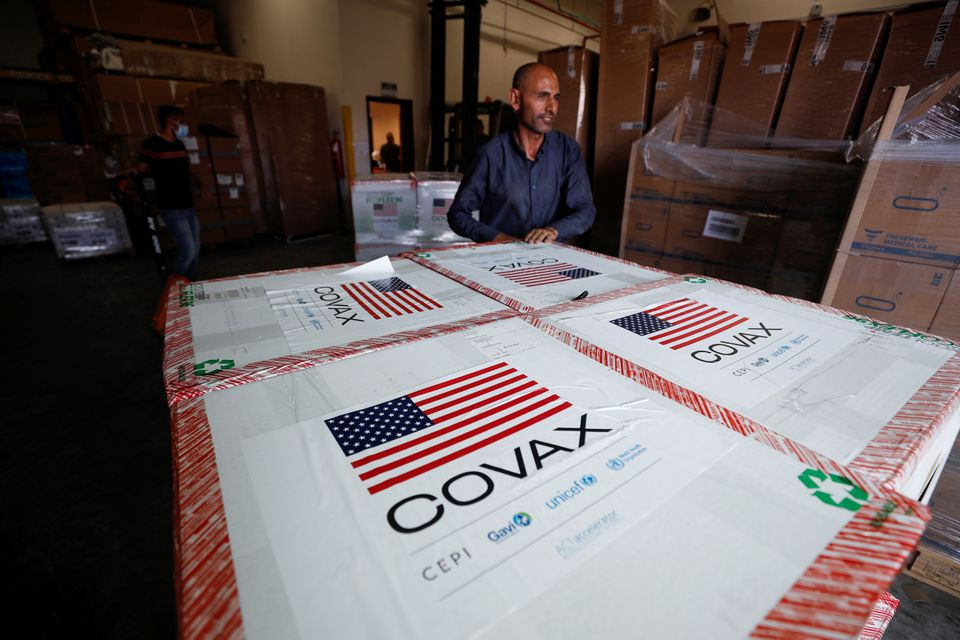 palestinians receive a shipment of doses with the moderna coronavirus disease covid 19 vaccine donated by the us in salem village in the israeli occupied west bank august 24 2021 reuters