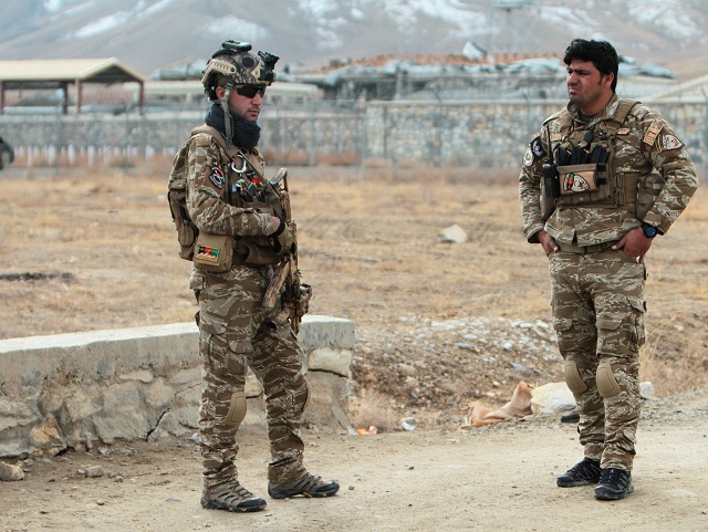 afghan national security forces keep watch outside of a military compound after a car bomb blast on the outskirts of ghazni city afghanistan november 29 photo reuters