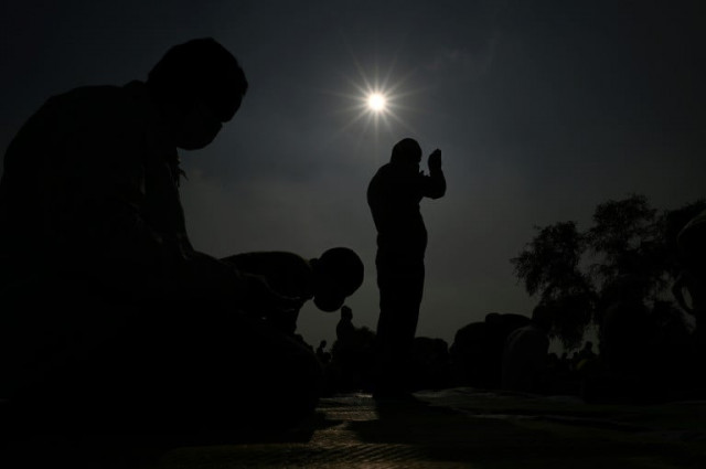 muslim devotees offer friday prayers in an open ground in gurgaon after several prayer sites were closed by the authorities photo afp