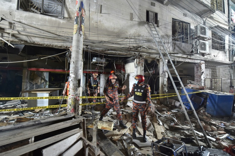 firefighters inspect the scene after a suspected gas explosion in a central neighbourhood in the bangladesh capital dhaka photo afp