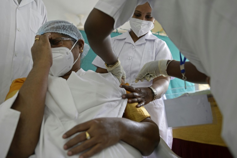 by july india aims to vaccinate 300 million of the 1 3 billion population against covid 19 afp