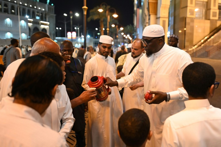 a saudi family distributes free tea to pilgrims in makkah for the hajj pilgrimage photo afp