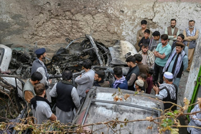 afghan relatives gather on august 30 2021 next to a damaged vehicle after a us drone strike that has come under scrutiny photo afp file afghan relatives gather on august 30 2021 next to a damaged vehicle after a us drone strike that has come under scrutiny photo afp file