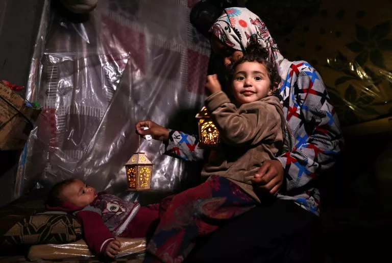 a palestinian child plays with traditional fanous lanterns as muslim devotees prepare for the start of the holy fasting month of ramazan in rafah in the southern gaza strip photo afp a palestinian child plays with traditional fanous lanterns as muslim devotees prepare for the start of the holy fasting month of ramazan in rafah in the southern gaza strip photo afp