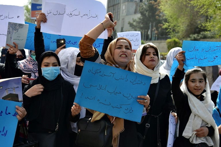 afghan women and girls protest in front of the ministry of education in kabul in march 2022 demanding high schools be reopened photo afp