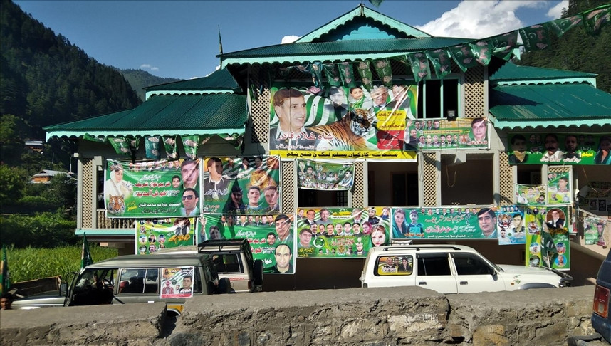 placards of candidates are hung on a building ahead of election of regional assembly planned to be on july 25 in azad kashmir pakistan on july 18 2021 photo aa