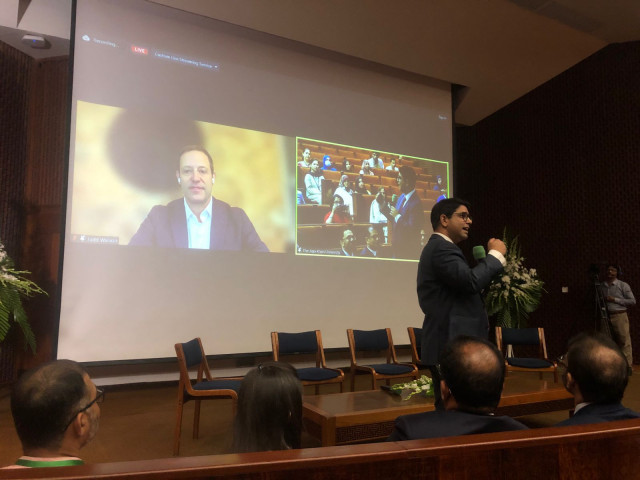 dean adil haider of the aku medical college thanks dr judd walson on screen after he delivers his keynote address at the inauguration of research week of the department of paediatrics and child health on campus friday sept 1 2023 walson is the chair of international health at johns hopkins university baltimore photo aku