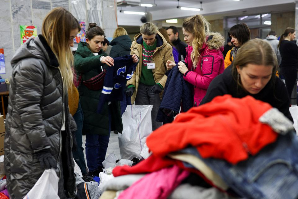 volunteers sort through supplies donated by members of the public that are destined for internally displaced people civil defence troops and the military in lviv ukraine february 28 2022 reuters