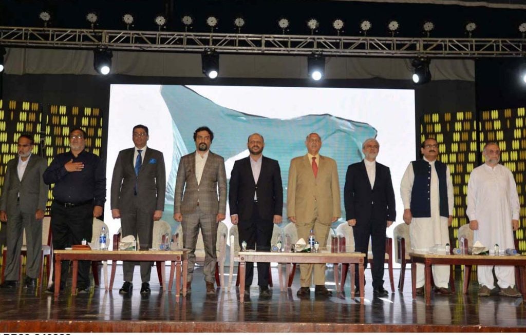 senator mushahid hussain syed ministry of corporation and labour social welfare mehdi maskani and others stand in the honor of the national anthem during pak iran trade exhibition at pak china friendship center photo app