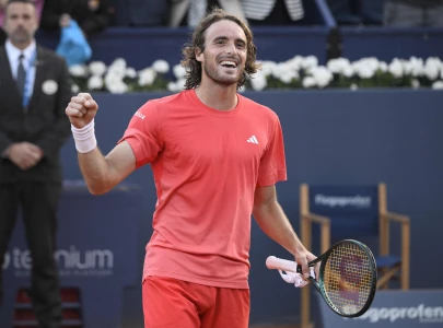 tsitsipas saves two match points to reach barcelona semi finals