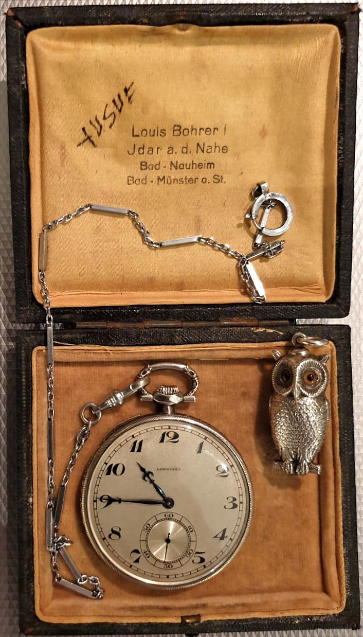 A Longines dress watch was purchased by Sir Samad at Munster, Germany in 1935 and presented to his son Yusuf. The owl has a lead pencil to jot down brief notes at a meeting.
