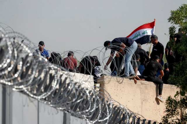 supporters of iraqi populist leader moqtada al sadr protest at the green zone in baghdad iraq august 29 2022 reuters supporters of iraqi populist leader moqtada al sadr protest at the green zone in baghdad iraq august 29 2022 reuters