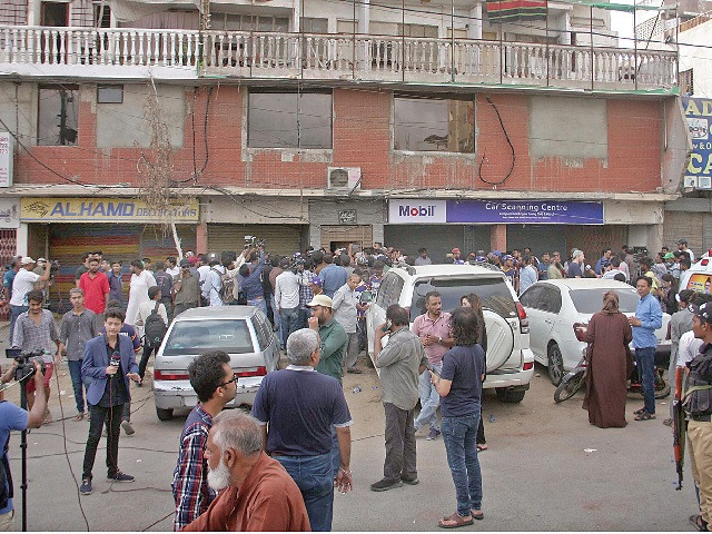 people and media persons gather outside the residence of dr aamir liaquat hussain following his death on thursday photo online