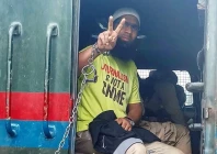 aasif sultan seen gesturing from the police vehicle outside a srinagar court photo x cpjasia