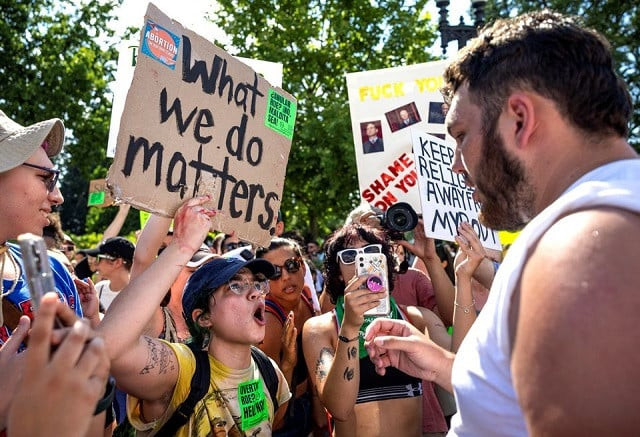 an abortion rights activist argues with one of a handful of anti abortion protestors near the united states supreme court in washington us june 25 2022 photo reuters an abortion rights activist argues with one of a handful of anti abortion protestors near the united states supreme court in washington us june 25 2022 photo reuters