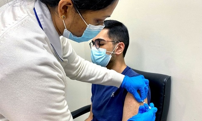 a man receives a dose of a vaccine against the coronavirus disease covid 19 photo reuters