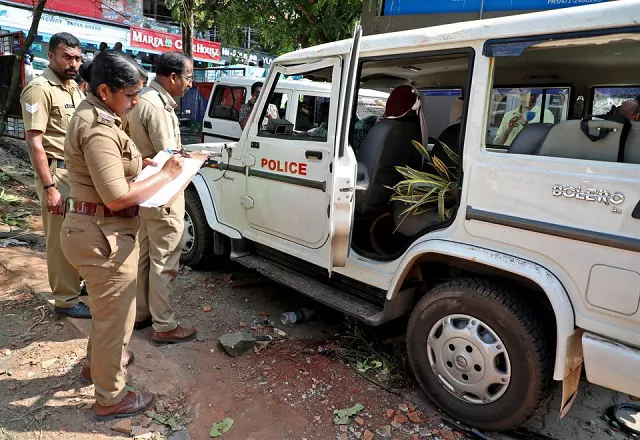 police officers examine a vehicle that was damaged during a clash with protesters at a police station near the proposed vizhinjam port in the southern state of kerala india november 28 2022 photo reuters police officers examine a vehicle that was damaged during a clash with protesters at a police station near the proposed vizhinjam port in the southern state of kerala india november 28 2022 photo reuters