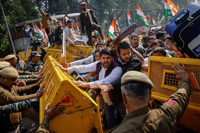 activists of the youth wing of india s main opposition congress party try to break a police barricade during a protest against what they say investments by life insurance corporation lic and state bank of india sbi in adani group in new delhi india february 6 2023 photo reuters activists of the youth wing of india s main opposition congress party try to break a police barricade during a protest against what they say investments by life insurance corporation lic and state bank of india sbi in adani group in new delhi india february 6 2023 photo reuters