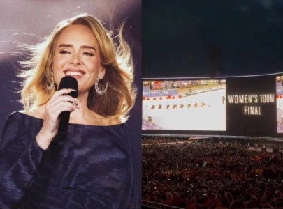 watch adele screens olympic women s 100m final for munich concert audience