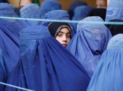 afghan women defiant but feel imprisoned by order to cover faces