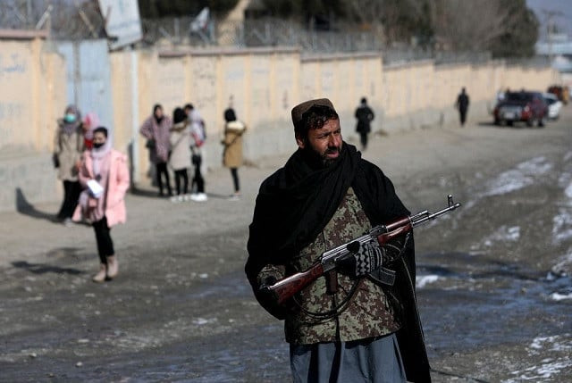 a taliban fighter guards a street in kabul afghanistan december 16 2021 photo reuters a taliban fighter guards a street in kabul afghanistan december 16 2021 photo reuters
