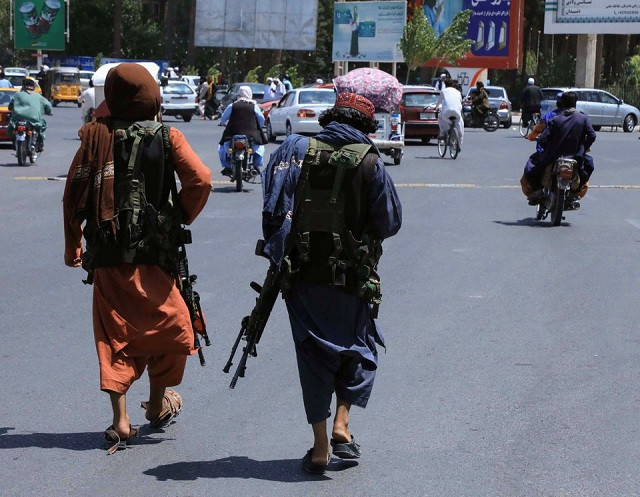 Taliban forces patrol a street in Herat, Afghanistan August 14, 2021. PHOTO: REUTERS