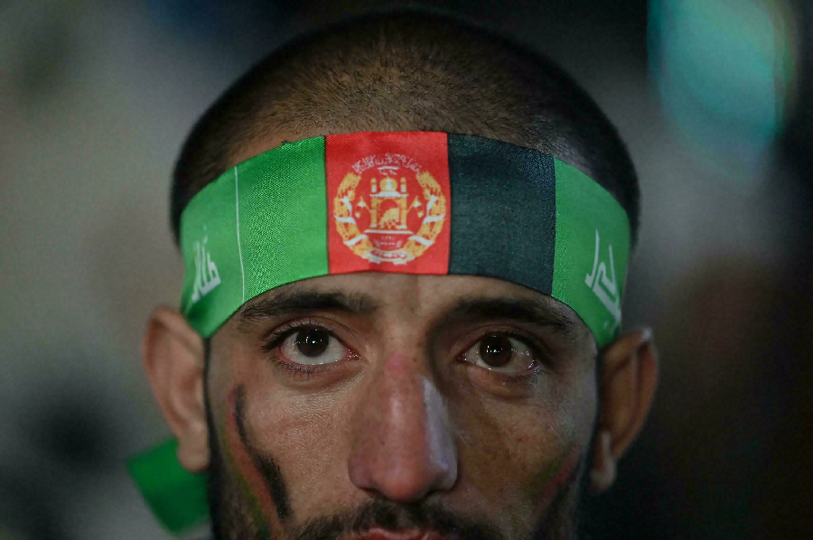 Afghan cricket fans who gathered at an amusement park on the outskirts of Kabul wore their national colours, rather than the white and black Taliban banner. PHOTO: AFP