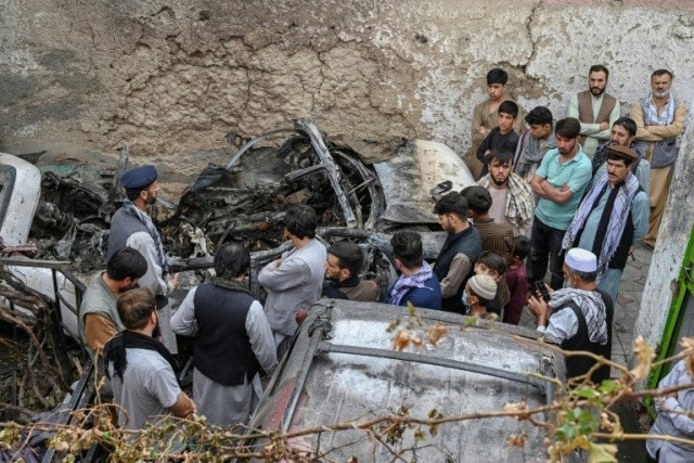 afghan relatives gather on august 30 2021 next to a damaged vehicle after a us drone strike that has come under scrutiny photo afp file afghan relatives gather on august 30 2021 next to a damaged vehicle after a us drone strike that has come under scrutiny photo afp file