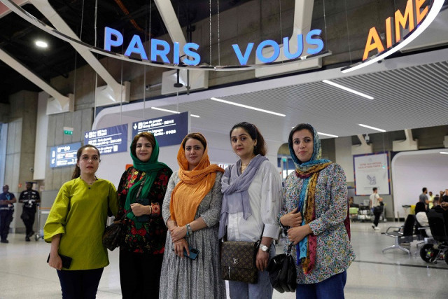 from l english teacher hafsa najla latif president of a science faculty naveen hashim researcher and women s rights activist zakia abasi former employee of a beauty salon and muzhgan feraji tv journalist pose for a photograph upon their arrival at the roissy charles de gaulle airport following their evacuation from pakistan september 4 2023 photo afp from l english teacher hafsa najla latif president of a science faculty naveen hashim researcher and women s rights activist zakia abasi former employee of a beauty salon and muzhgan feraji tv journalist pose for a photograph upon their arrival at the roissy charles de gaulle airport following their evacuation from pakistan september 4 2023 photo afp