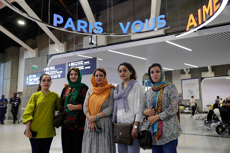 from l english teacher hafsa najla latif president of a science faculty naveen hashim researcher and women s rights activist zakia abasi former employee of a beauty salon and muzhgan feraji tv journalist pose for a photograph upon their arrival at the roissy charles de gaulle airport following their evacuation from pakistan september 4 2023 photo afp