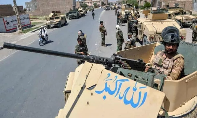 an afghan national army commando stands guard on a vehicle in herat province on sunday photo afp an afghan national army commando stands guard on a vehicle in herat province on sunday photo afp