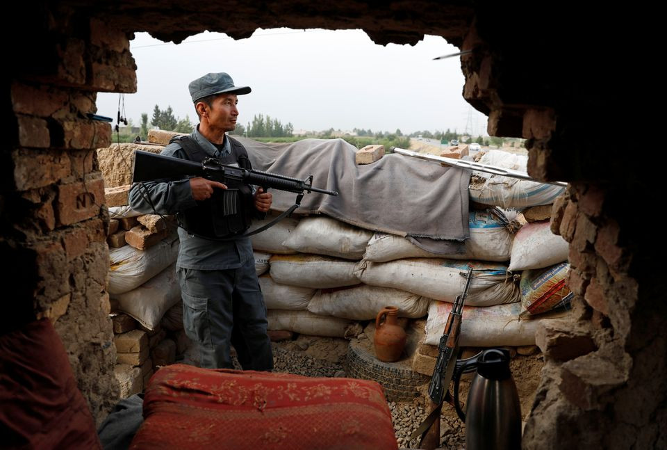 an afghan policeman keeps watch at the check post on the outskirts of kabul afghanistan july 13 2021 photo reuters