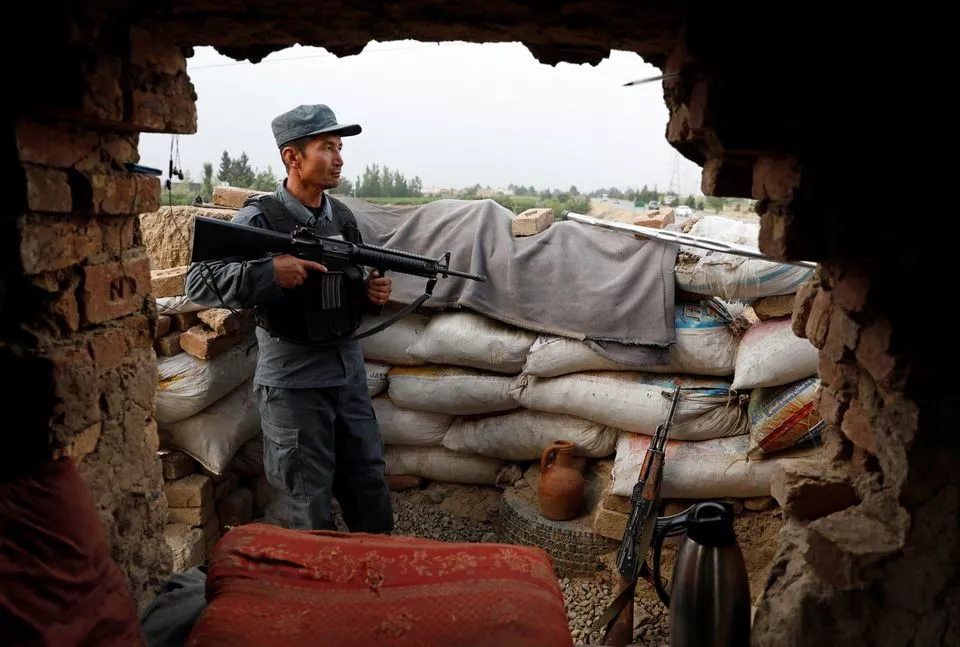 an afghan policeman keeps watch at the check post on the outskirts of kabul afghanistan july 13 2021 photo reuters an afghan policeman keeps watch at the check post on the outskirts of kabul afghanistan july 13 2021 photo reuters