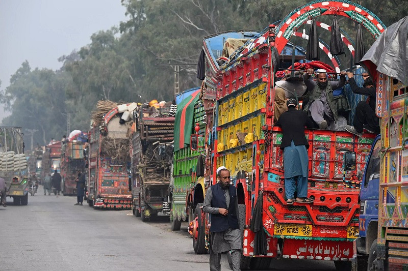 Trucks carrying Afghan refugees in Nowshera, Pakistan. PHOTO: AFP