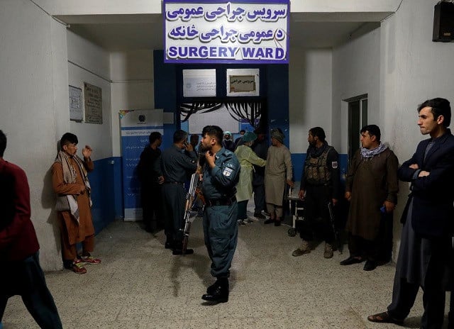 an afghan policeman stands guard inside a hospital after a blast in kabul afghanistan may 8 2021 photo reuters