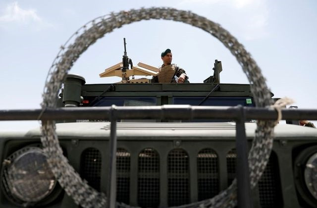 an afghan security forces member keeps watch as he sits in an army vehicle in bagram us air base after american troops vacated it in parwan province afghanistan july 5 2021 photo reuters