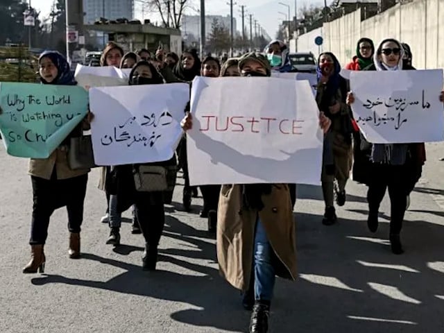 afghan women hold placards during the protest in kabul to demand an end to the extrajudicial killings by the taliban photo afp