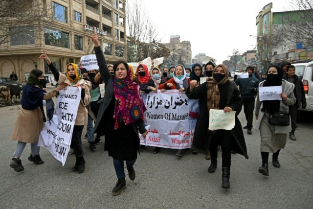 afghan women march as they chant slogans and hold banners during a women s rights protest in kabul on january 16 2022 photo afp file afghan women march as they chant slogans and hold banners during a women s rights protest in kabul on january 16 2022 photo afp file