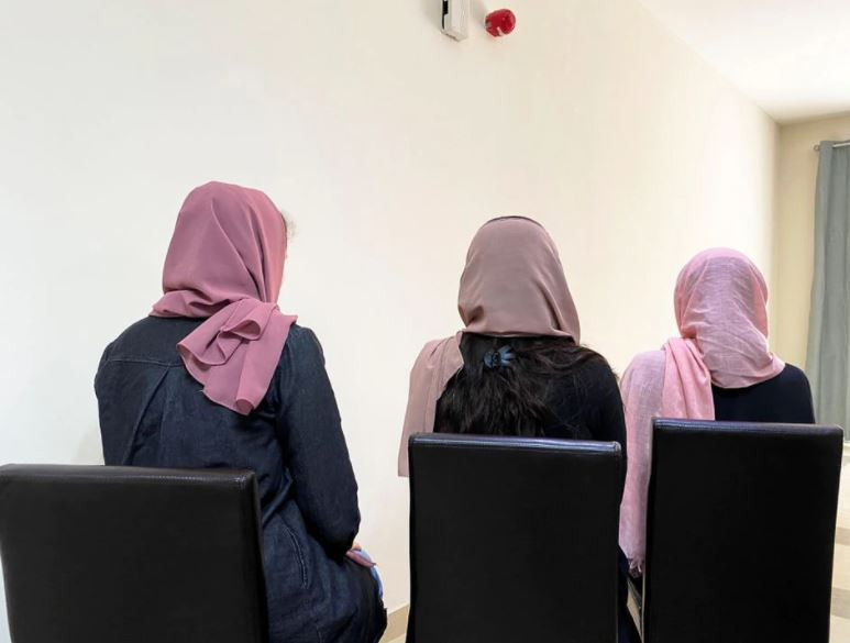 three young afghan female university students who have fled their country pose for a photo hiding their identity over safety concerns for family in afghanistan at a residential compound in doha qatar august 22 2021 photo reuters