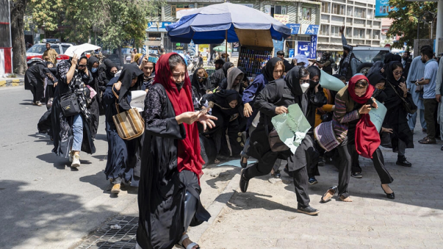 women protesters flee as taliban fighters fire their guns in the air at a rally in kabul photo afp women protesters flee as taliban fighters fire their guns in the air at a rally in kabul photo afp